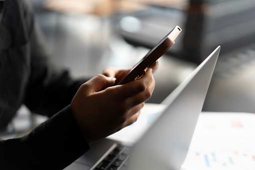 Close-up of young woman hand using smartphone